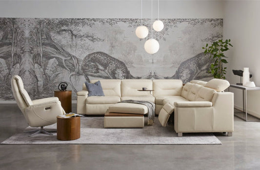 White leather sectional couch with recliners and ottoman