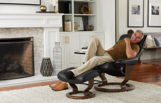 Man lounging on stressless chair