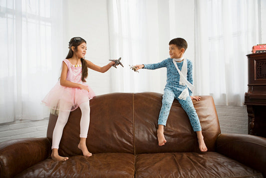 kids playing on leather couch